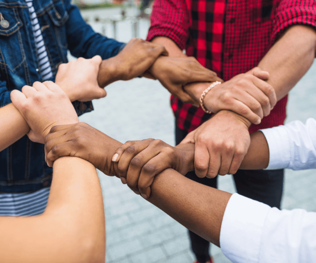 anonymous-multiracial-people-stacking-hands