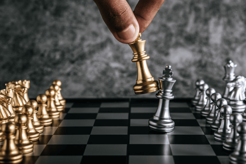 hand-man-playing-chess-business-planning-comparison-metaphor-selective-focus